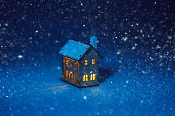fabulous little house in the snow at night