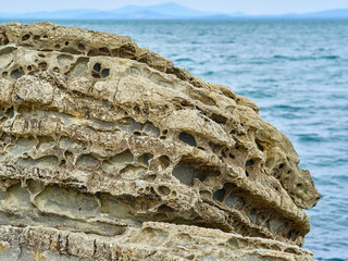 a rock eaten away by sea water over the years