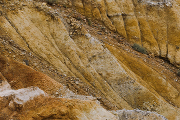 Red sandy slopes of canyon. Corrosion the soil after drought and global warming. Lack of water in stone desert