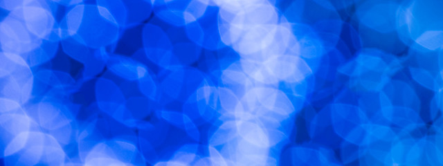 Blue and white lens flare blurry, round. Bokeh.Textural background. Size 8:2.