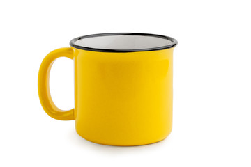Side view of empty yellow enamel coffee mug isolated on white background.