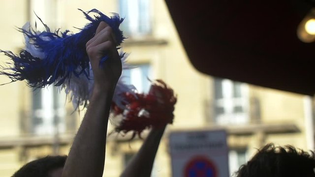 French supporter shaking a scarf with french colors