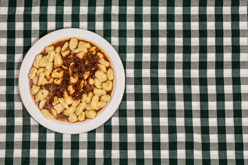 Plate of homemade gnocchi with tomato sauce