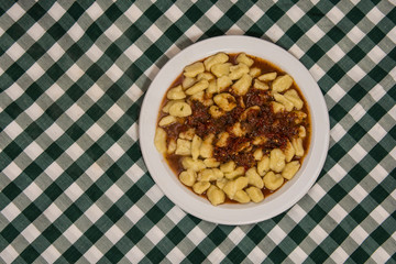 Plate of homemade gnocchi with tomato sauce