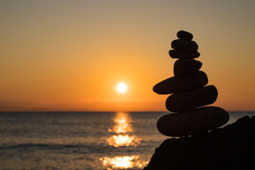 Zen concept. Sunset. The object of the stones on the beach at sunset.  Relax & Meditation. Zen stones.