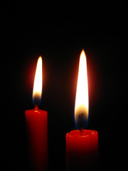 red candle in the dark