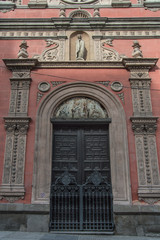 entrance with neo-plateresque door of the church of Las Calatravas in Madrid. Spain