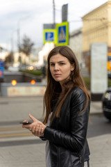 young woman with tablet in the city