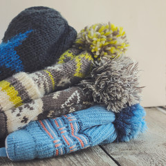 Baby boy hats on a wooden background