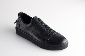 Black men leather shoe with shoelaces on white background