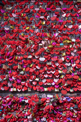 Valentine's Day - many red padlocks (hearts) at a fence