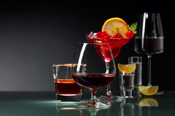 Various alcoholic drinks on a black background.