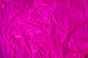 The texture of crumpled purple crumpled paper