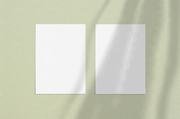 Blank white vertical paper sheet 5x7 inches with shadow overlay. Modern and stylish greeting card or wedding invitation mock up.