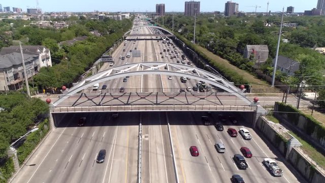 Aerial view of traffic over major freeway in Houston, Texas. This video was filmed in 4k for best image quality.
