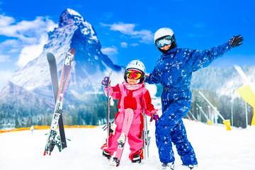 Ski, winter and fun - Family: mother and daughter enjoying winter vacations. Matterhorn