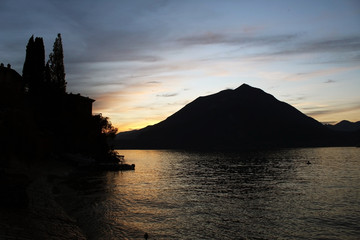 Mountain reflecting on a lake surface at sunset