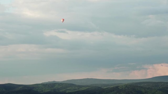 Hot Air Balloon flying over forests and hills near Liberec, Czech Republic