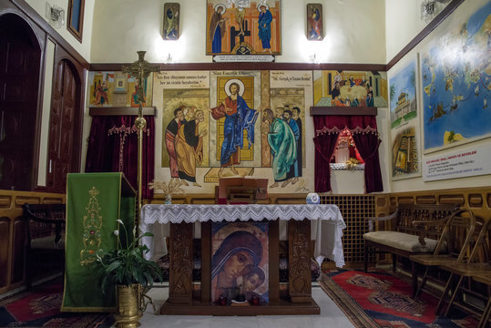 Antakya, Hatay / Turkey : October 30 / 2019 : view of the altar of catholic church of antioch with the religious paintings and words from bible