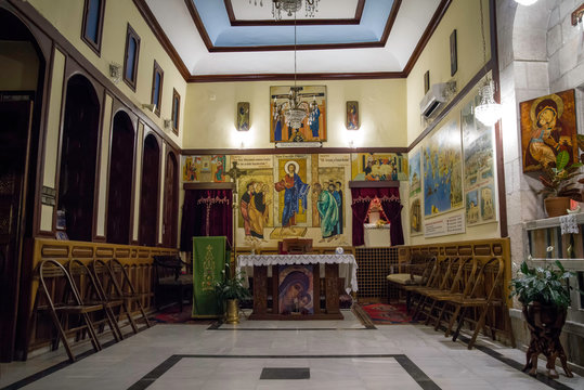 Antakya, Hatay / Turkey : October 30 / 2019 : view of the altar of catholic church of antioch with the religious paintings and words from bible