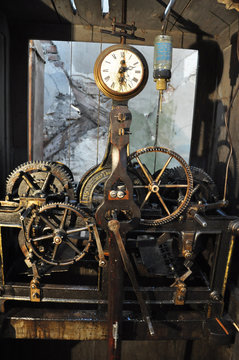 The mechanism of the old clock mounted on the town hall.