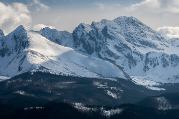 Fototapeta na wymiar Tatra Mountain in wintertime, landscape with at snowcapped peaks of Tatra mountains Poland Zakopane