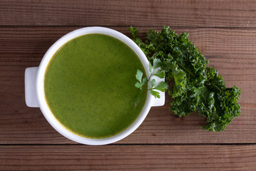 cream or natural vegetable soup on rustic wooden background