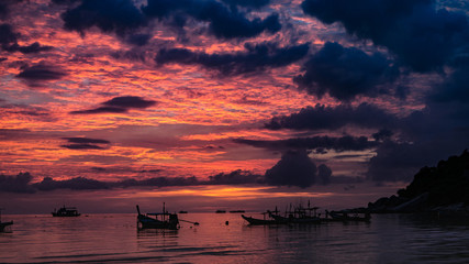 pink and red sunset on the sea in thailand