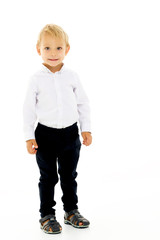 Handsome little boy in full growth on a white background. The co