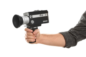 Man with vintage video camera on white background, closeup of hand