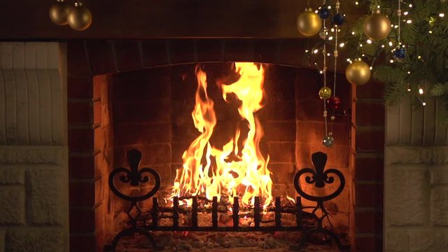 burning fireplace on christmas evening