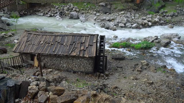 Aladaglar National Park waterfalls, waterfall in Aladaglar National Park in Turkey, Kapuzbasi waterfall Kayseri Turkey, water mill on the waterfalls, Old weathered wooden water mill building, Old fash