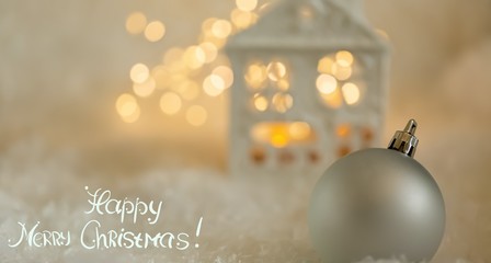 Greeting card Happy New Year. Ball and Beautiful blurred blue background of winter decoration for the holiday. Soft focus