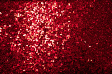 Red sequinned background . Holidays backgrounds and textures . Christmas and St. Valentine’s Day...