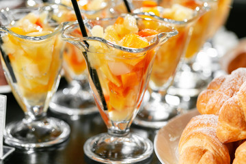 Breakfast buffet. Fresh fruit cocktail in glasses. Dessert with pieces of fruit. Morning hotel breakfast buffet.