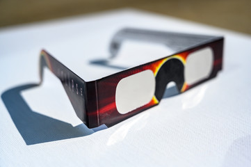 Cheap Solar eclipse shade glasses on white board