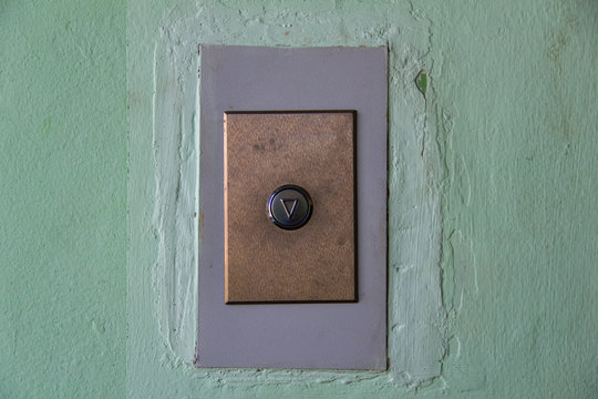 modern elevator arrow button on old shabby wall - Powered by Adobe