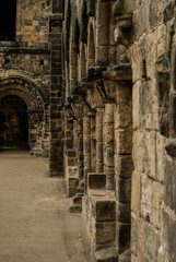 Fototapeta na wymiar Kirkstall Abbey, Leeds: ruins of room entrances..