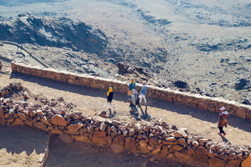 Sinai Peninsula, Egypt, May 9, 2019: Pilgrims descend from Mount Moses at sunrise