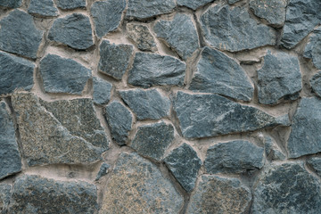 Stone wall. Wall made of stones.