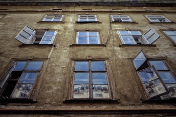 Obraz premium Facade of an old house with open windows