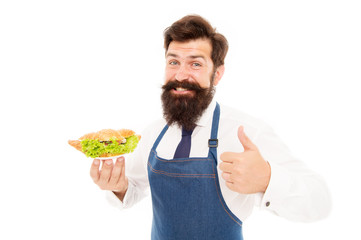 You will like his cooking. Bearded man give thumbs up to dish. Happy cook enjoy cooking food. Confident in his cooking skills. Cooking healthy and energetic food