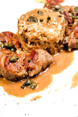 Meal with stuffed chicken and risotto with a sauce