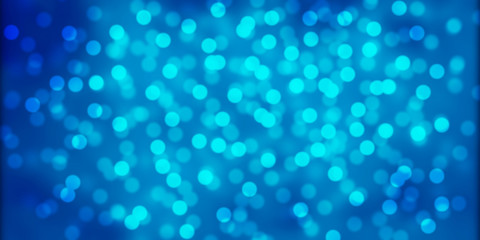 Beautiful blue bokeh background. Bright light effect. Glowing particles on a colored background. 
