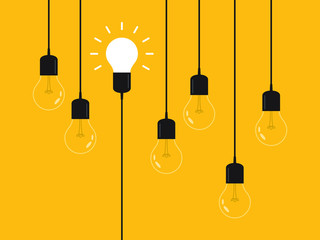 Set of hanging light bulbs with one glowing. Leadership, power and uniqueness concept.