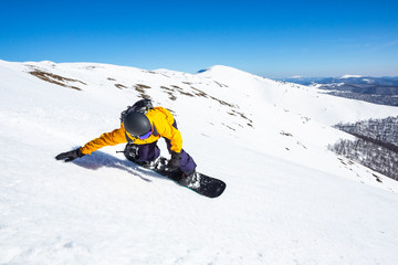 A boy on the snowboard..