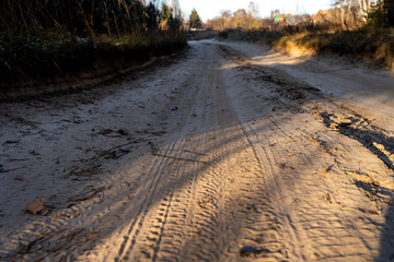 Road and truck traces on a sand