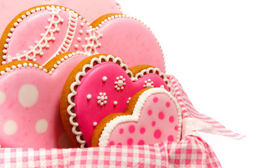 Set of pink heart shaped cookies with patterns, light background