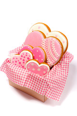 Set of pink heart shaped cookies with patterns, light background