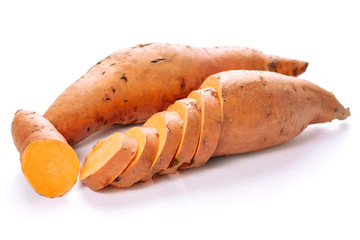 Orange Sweet Potato Beauregard Tuber and Slices Cut Out. Tuberous Ripe Raw Batata and Cross Section Pieces Isolated on White Background Photography. Ipomoea Batatas Prepared for Cooking